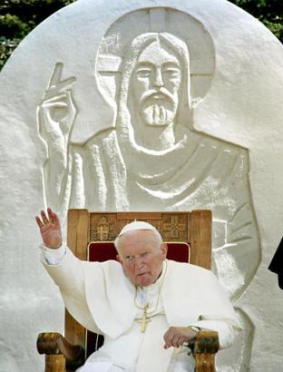Pope John Paul (news - web sites) II waves to the crowd at the beginning of a ceremony in Zadar, Croatia, Monday, June 9, 2003, the last day of his five-day-visit to Croatia. In background is a sculpture of Jesus Christ. (AP Photo/Michael Probst) 